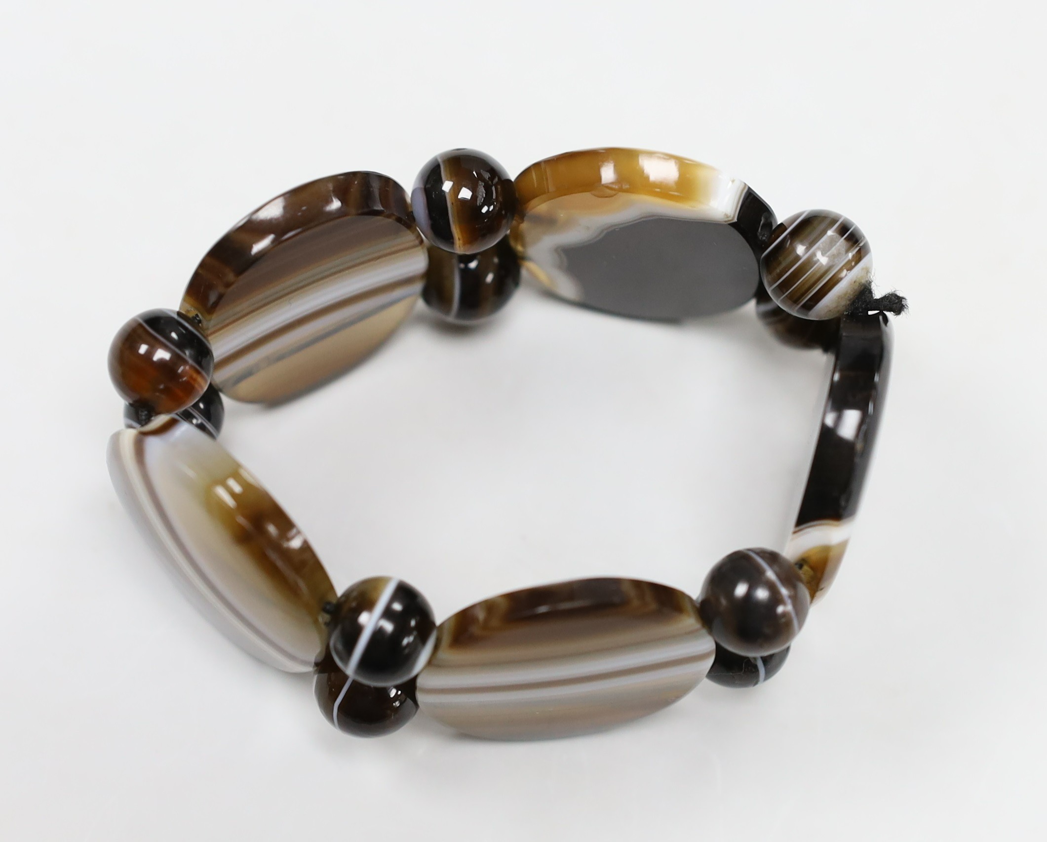 A banded agate oval link and bead bracelet.